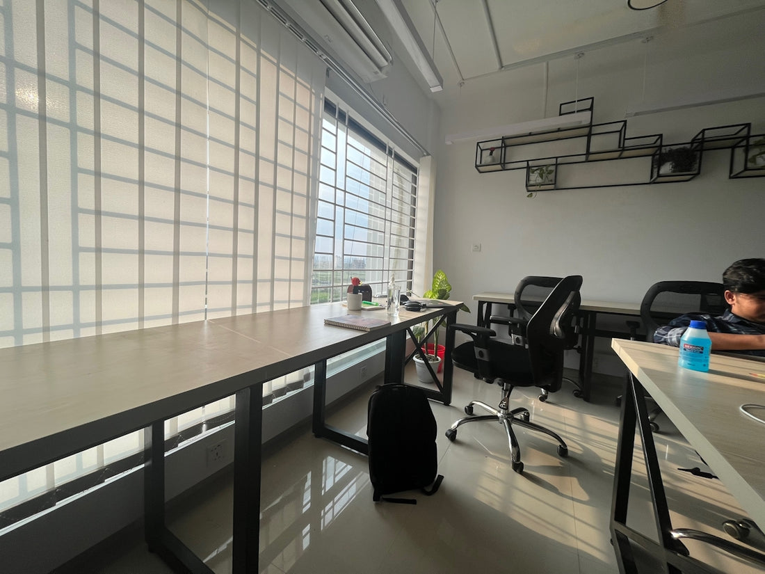 a man sitting at a desk in an office