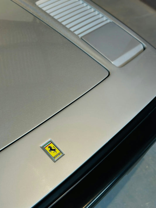 A close up of the hood of a car