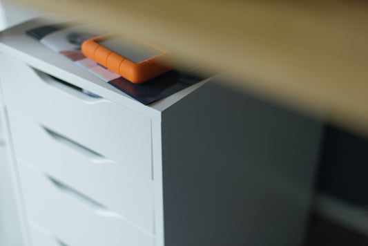 A drawer with a carrot on top of it