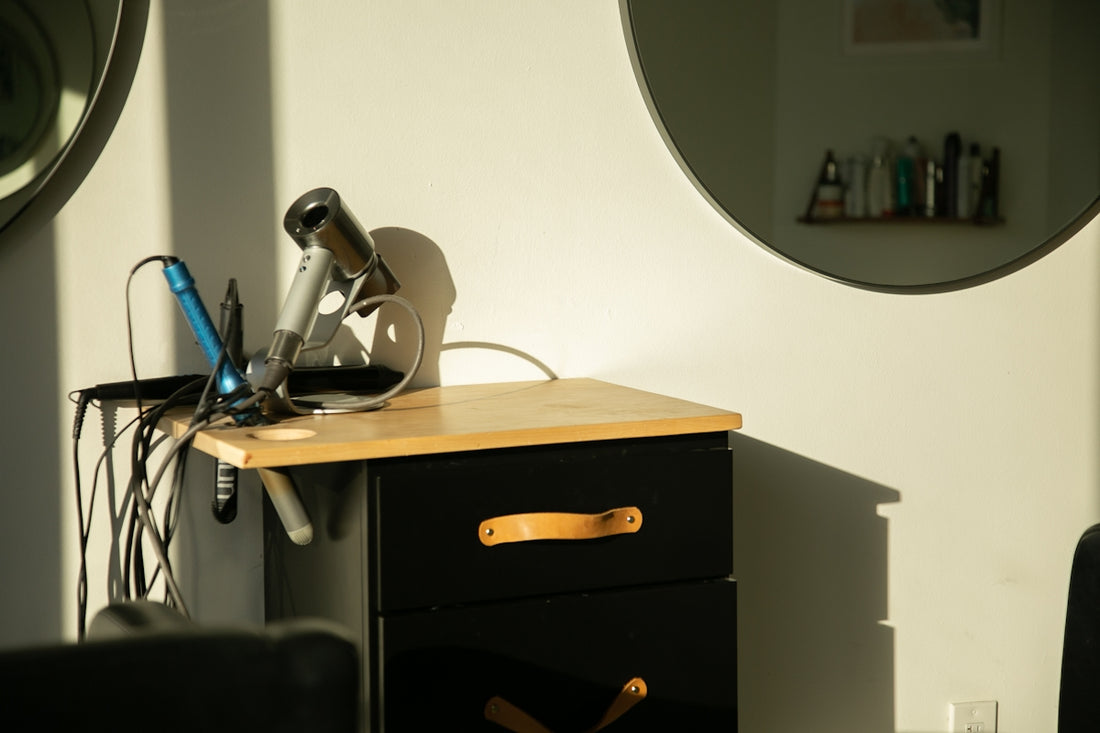 a hair dryer sitting on top of a wooden table