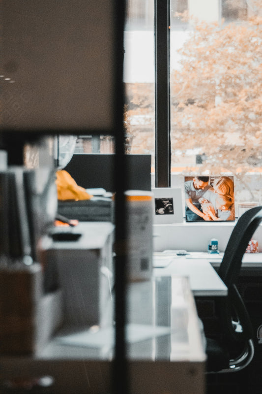 an office with a desk and a window