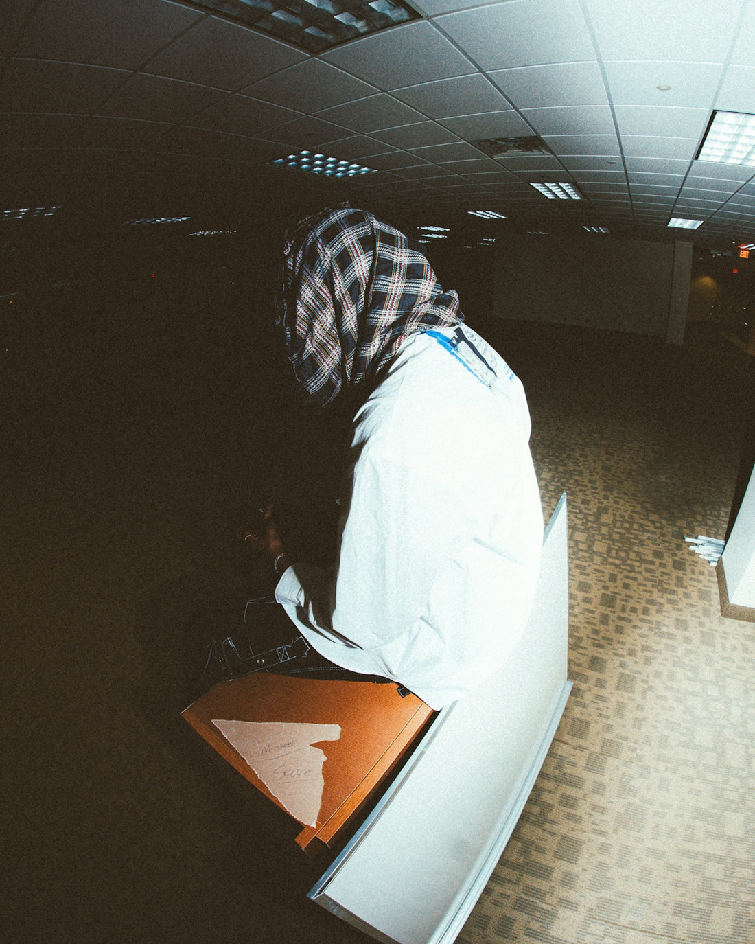 a person sitting on a bench in a room