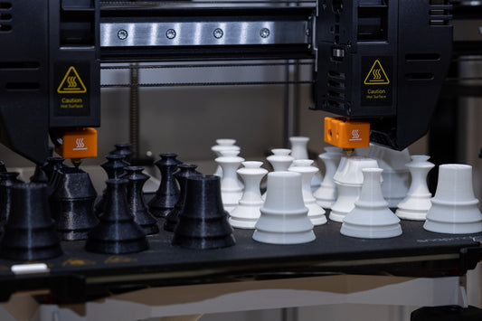 A black and white chess set on a table