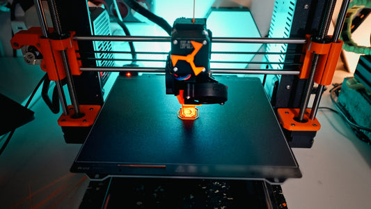 A 3D printer is creating a small object.