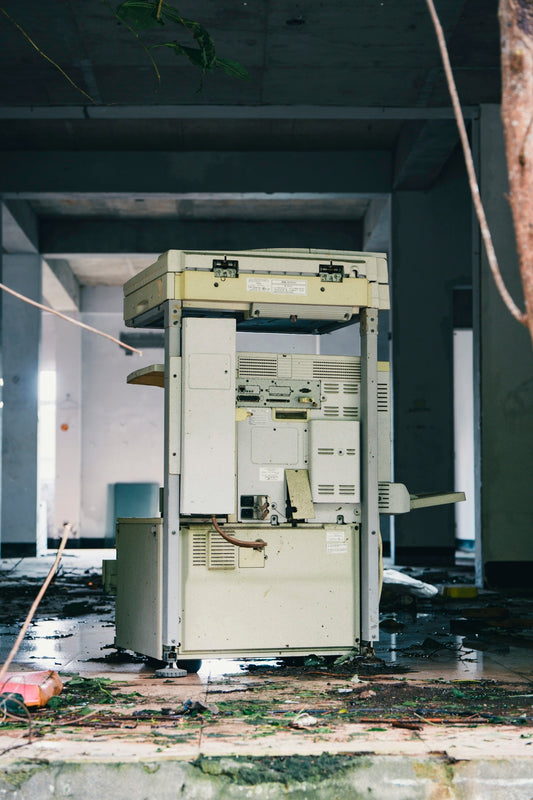 Abandoned office building with a broken photocopier.