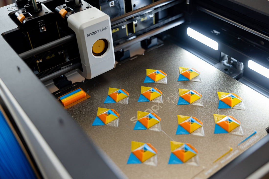 3D printer creating colorful geometric shapes