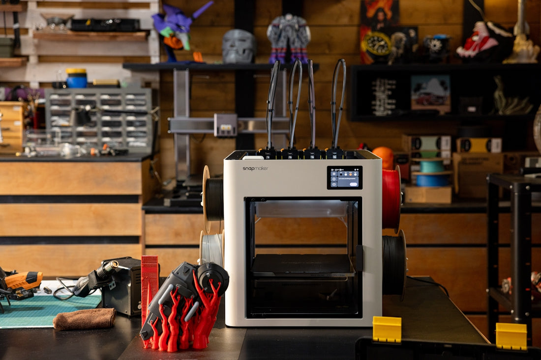 3D printer with tools and creations in workshop