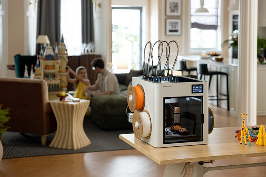 3D printer with filament rolls in a modern living room