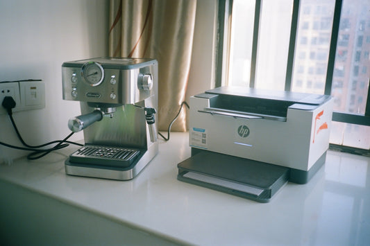 Espresso machine and hp printer on windowsill