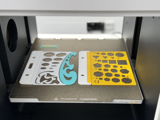 Two stencils for drawing shapes on a printer bed